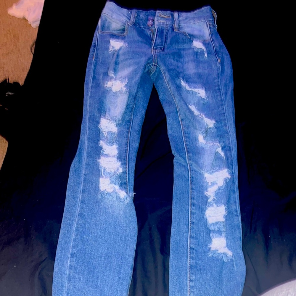 Slim tight blue jeans with rips